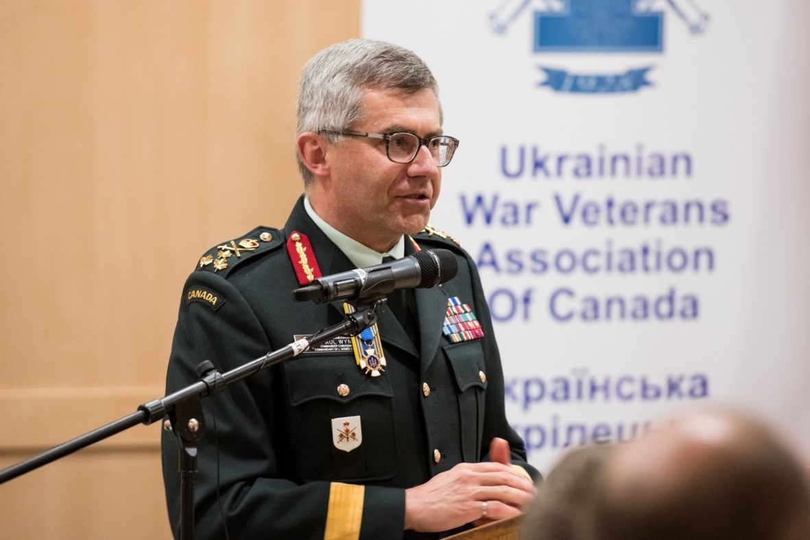 LGen Paul Wynnyk CMM MSM CD presenting to a packed house and wearing his Knight’s Cross. Photo by Stephen Parry.